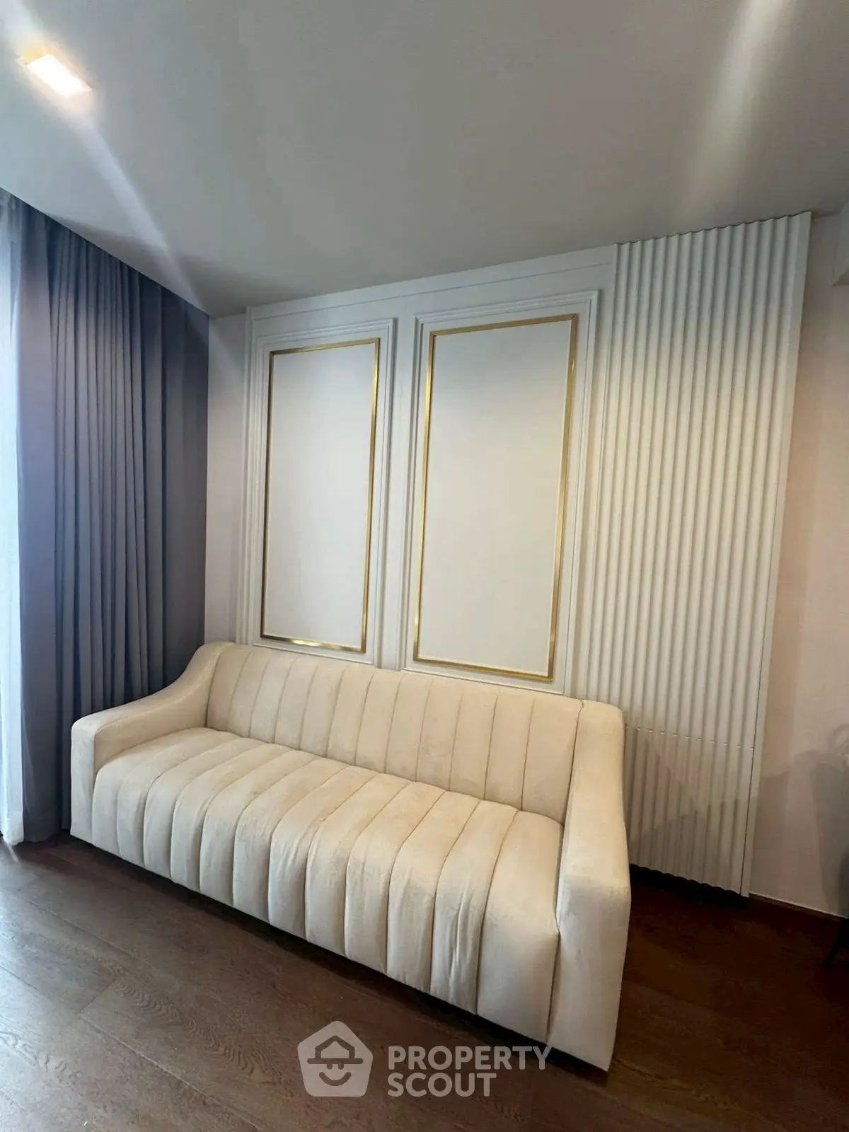 Elegant living room with stylish white sofa and modern decor