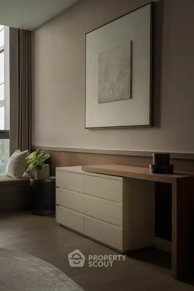 Elegant modern living room with stylish furniture and large window for natural light.