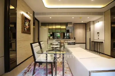 Luxurious modern living room with open kitchen, elegant dining area, and stylish decor.
