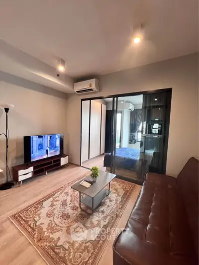 Modern living room with stylish decor and cozy ambiance in a contemporary apartment.
