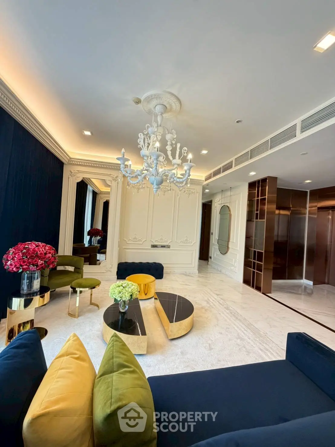 Luxurious living room with elegant chandelier and modern decor