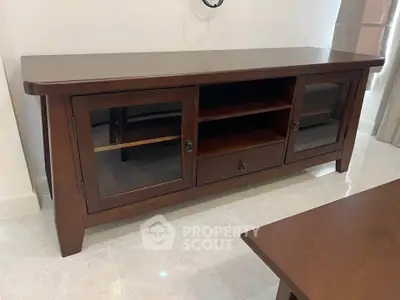 Elegant wooden sideboard in a modern living room setting.