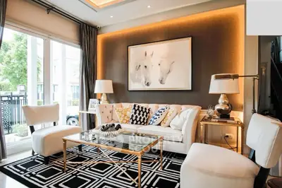 Luxurious living room with elegant decor and large windows for natural light.