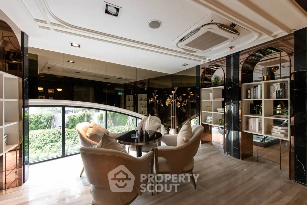 Luxurious modern living room with elegant furniture and large windows overlooking a lush garden.