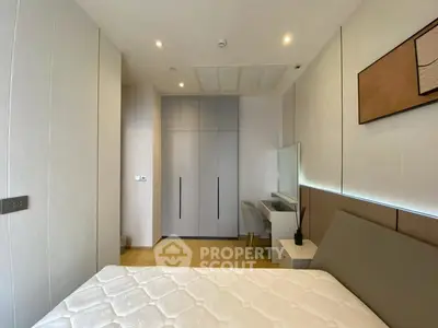 Modern bedroom with sleek design and built-in wardrobe