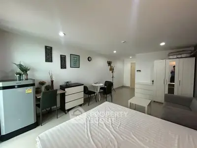Modern studio apartment with sleek furnishings and cozy ambiance