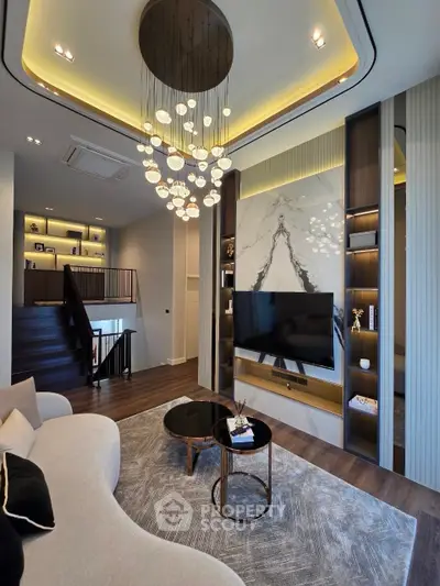 Luxurious modern living room with elegant chandelier and stylish decor