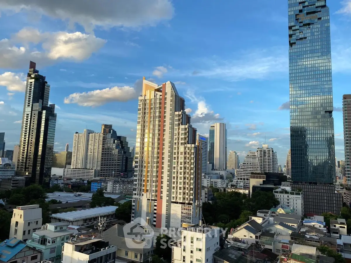 Stunning cityscape view showcasing modern skyscrapers under a vibrant blue sky, perfect for urban living enthusiasts.