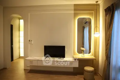 Elegant living room with modern TV setup and ambient lighting