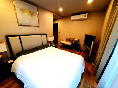 Luxurious bedroom with modern decor and cozy ambiance