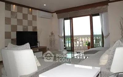Spacious living room with modern decor and balcony view
