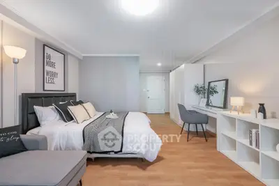 Spacious modern bedroom with stylish decor and cozy ambiance