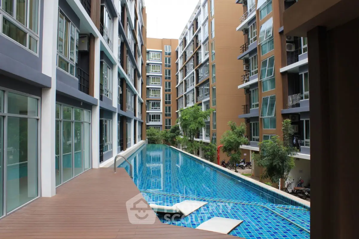 Luxurious condominium with a stunning swimming pool and modern architecture.