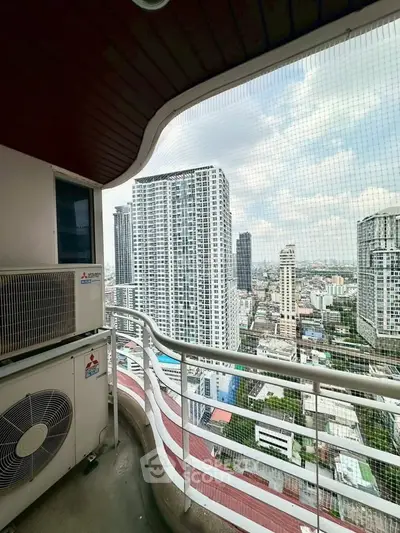 Stunning high-rise balcony view of city skyline with modern architecture.