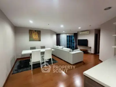 Spacious modern living room with elegant dining area and cozy seating, perfect for entertaining.