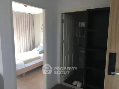 Cozy bedroom with adjacent bathroom in modern apartment