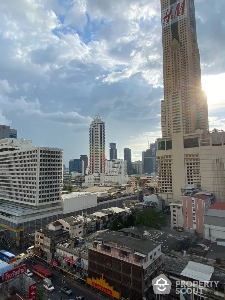 Stunning cityscape view with towering skyscrapers and vibrant urban landscape under a dramatic sky.