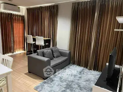 Spacious living room with modern decor and natural light