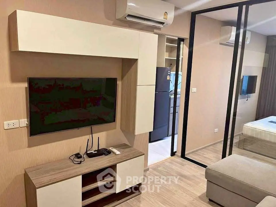 Modern living room with TV and air conditioning in a stylish apartment