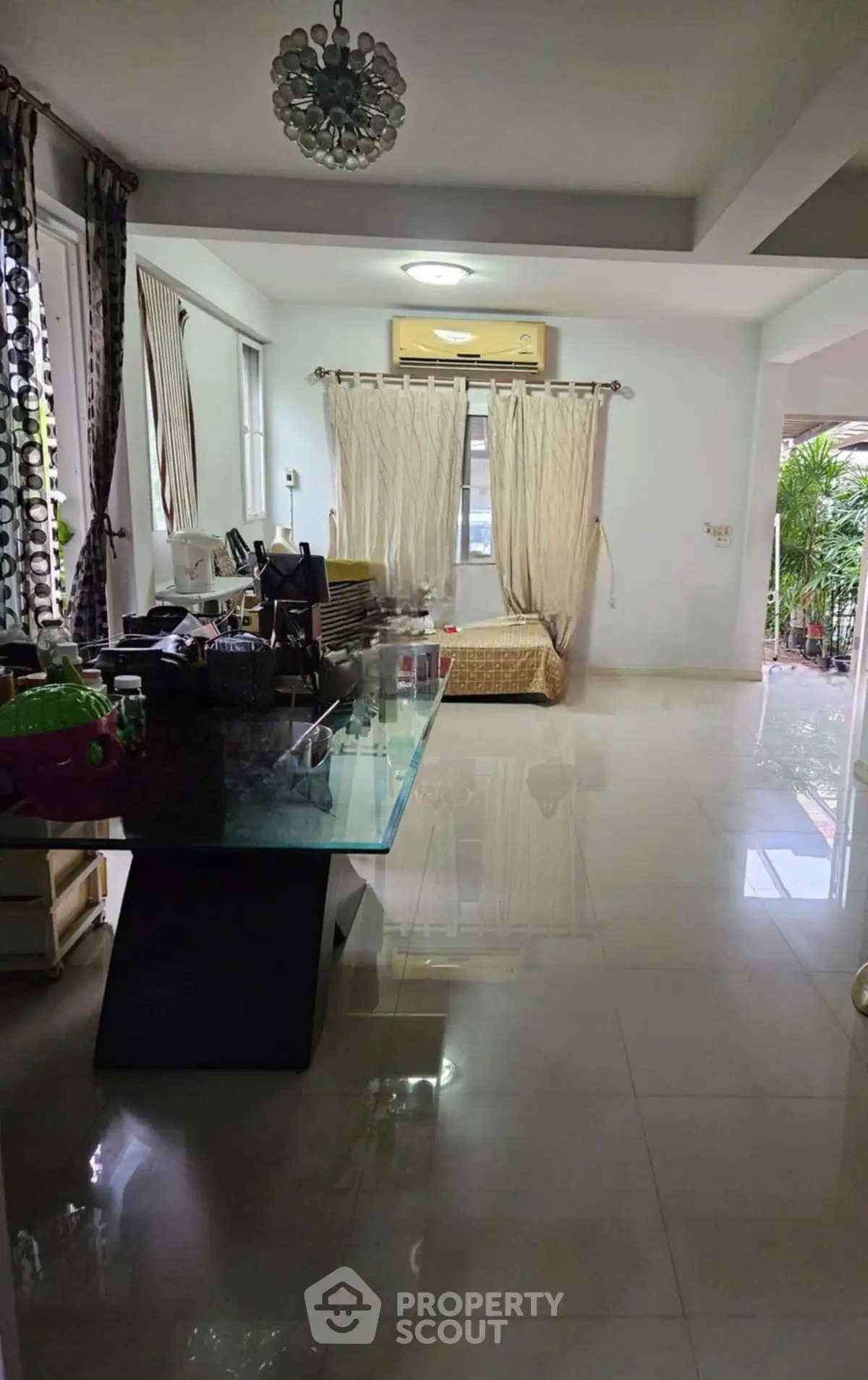 Spacious living area with modern decor and large windows for natural light.