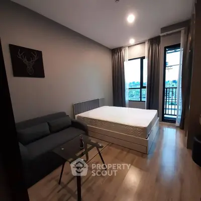 Modern bedroom with balcony view in stylish apartment