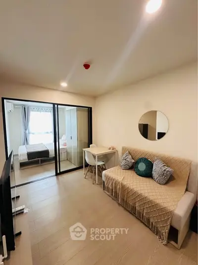 Modern living room with cozy sofa and stylish decor in a compact apartment