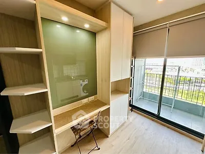 Modern study area with built-in desk and balcony view in urban apartment