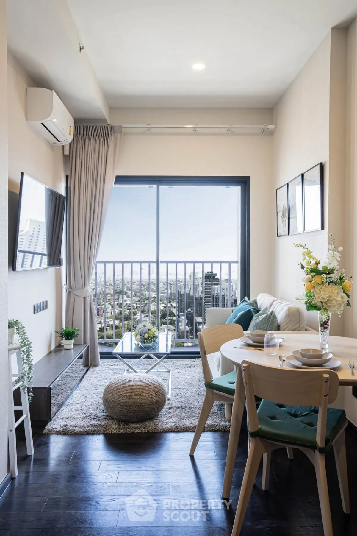 Chic modern living room with city view, cozy seating, and stylish decor