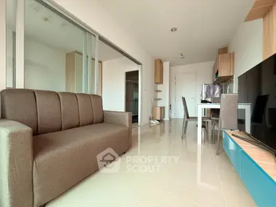 Modern living room with sleek furniture and open layout in a stylish apartment.