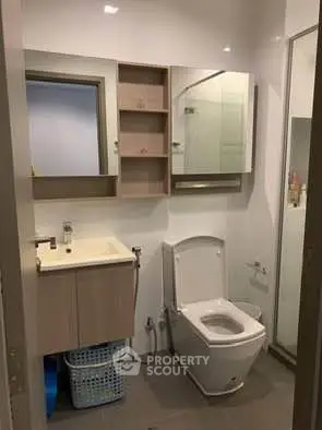 Modern bathroom with sleek fixtures and ample storage space