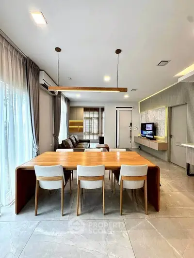 Spacious modern living room with elegant dining area and stylish decor