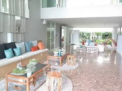 Spacious modern living room with elegant decor and abundant natural light