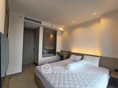 Modern bedroom with elegant lighting and large bed in a stylish apartment