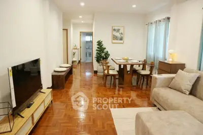 Spacious living room with wooden flooring and modern furniture