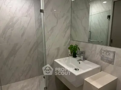 Modern bathroom with sleek design and glass shower enclosure