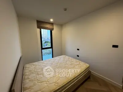 Cozy bedroom with large window and modern design