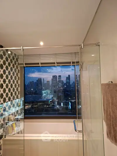 Modern bathroom with city skyline view through large window