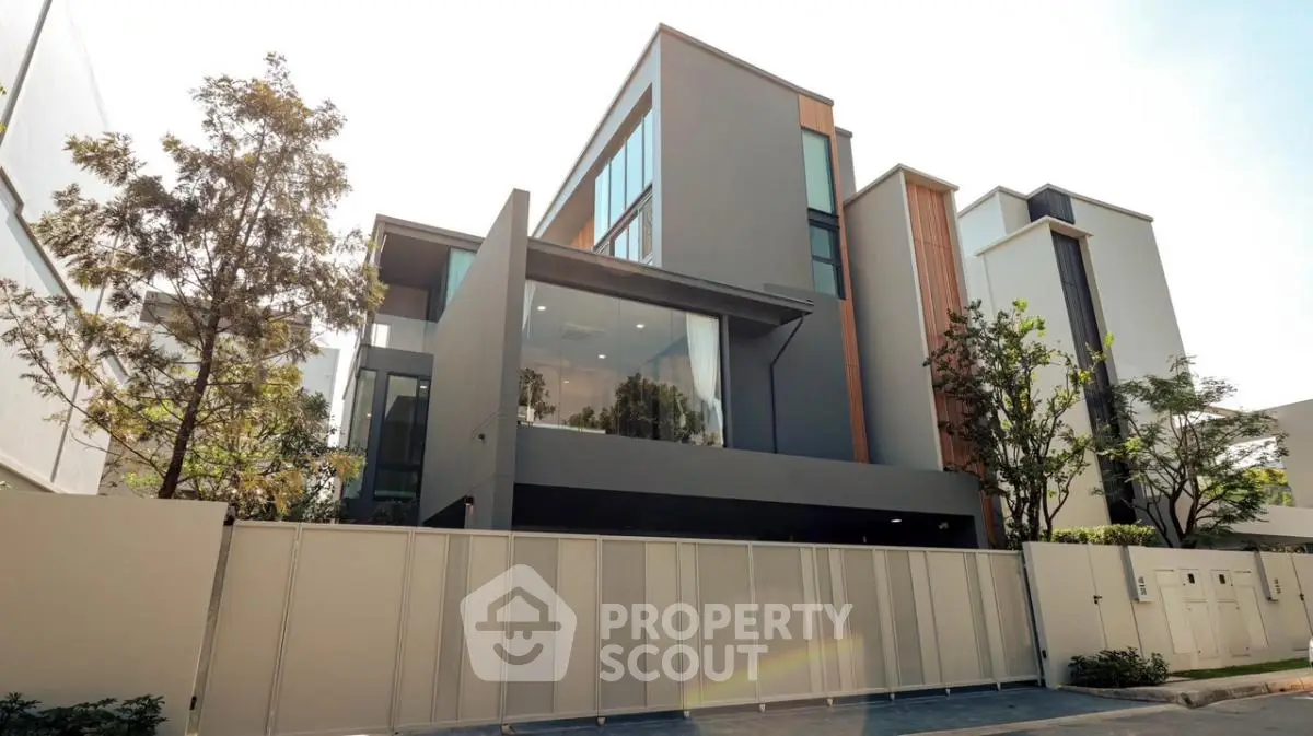 Modern luxury townhouse with sleek design and large windows in urban setting