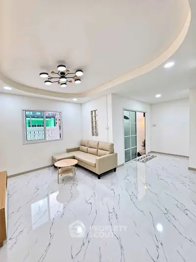 Modern living room with elegant lighting and marble flooring
