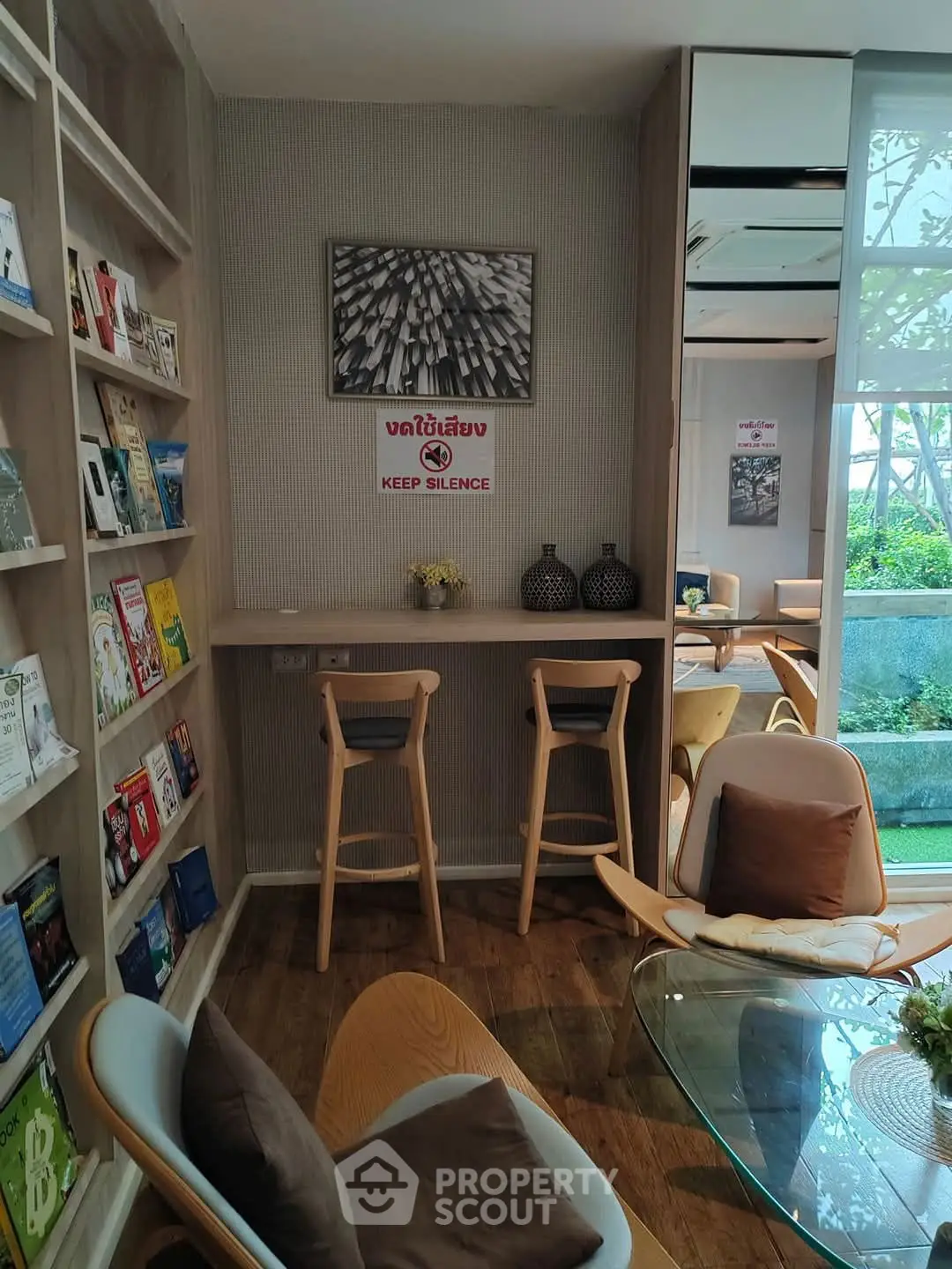 Cozy reading nook with modern chairs and bookshelves in serene setting