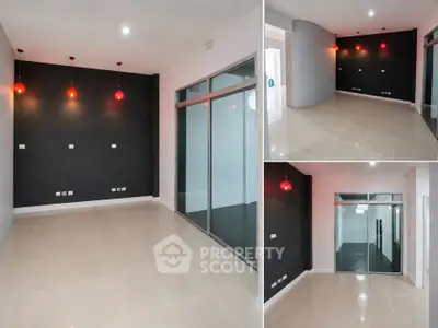 Modern interior with sleek black accent wall and stylish pendant lighting