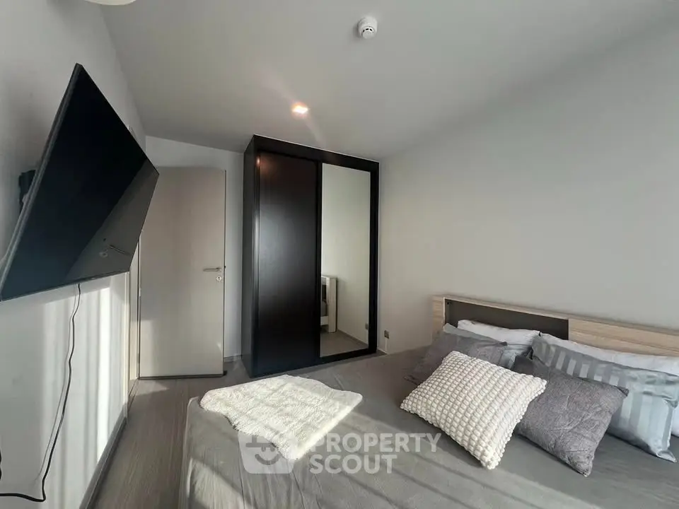 Modern bedroom with sleek design and cozy ambiance