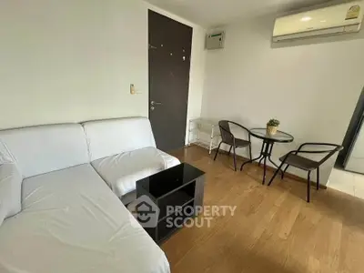 Modern living room with white sofa and air conditioning in cozy apartment