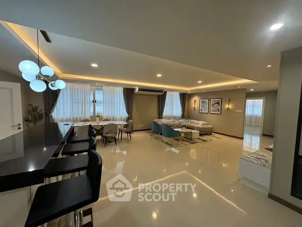 Spacious modern living room with elegant lighting and stylish furniture