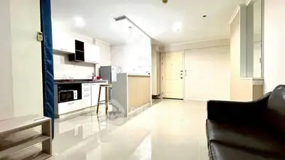 Spacious open-layout kitchen and living area with modern furnishings