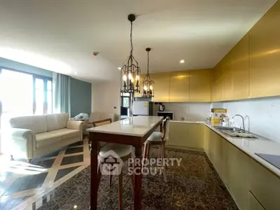 Luxurious open-layout kitchen with elegant lighting and spacious living area