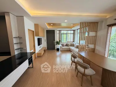 Spacious modern living room with open layout and elegant wooden accents