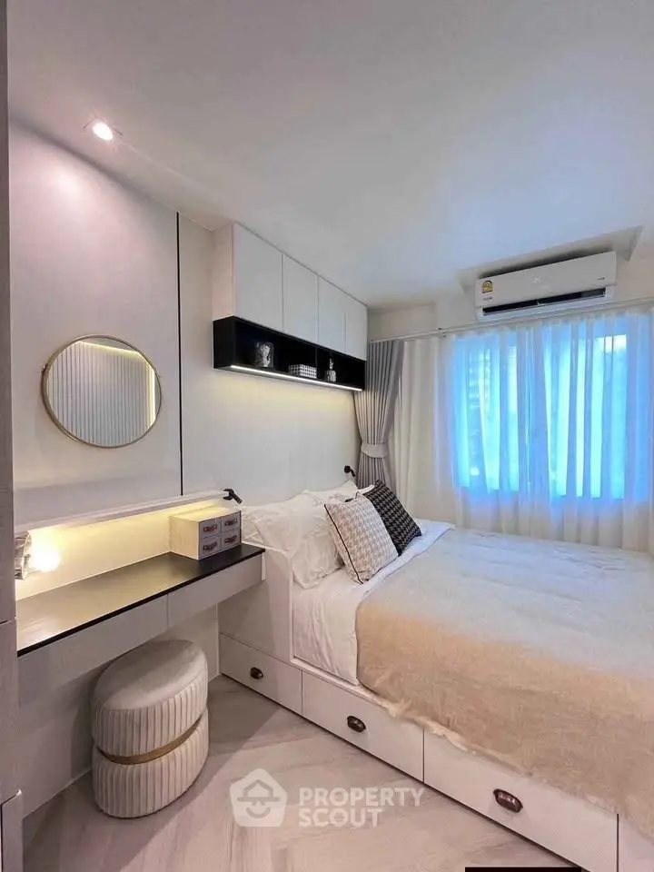 Cozy modern bedroom with stylish decor and ample storage space