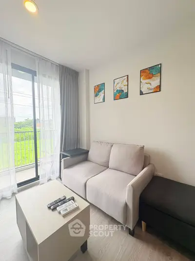 Modern living room with cozy sofa and balcony view in stylish apartment