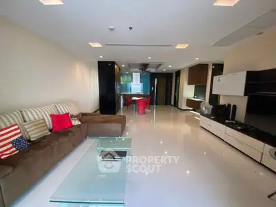 Spacious modern living room with sleek furniture and open layout, perfect for entertaining.